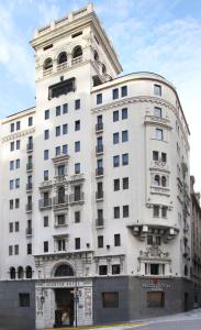a large white building with a lot of windows at NH Collection Buenos Aires Jousten in Buenos Aires