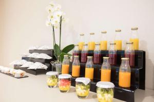 a group of bottles of juice on a table at NH Collection Buenos Aires Jousten in Buenos Aires