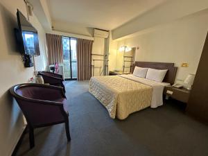 Letto o letti in una camera di Chian Huei Business Hotel