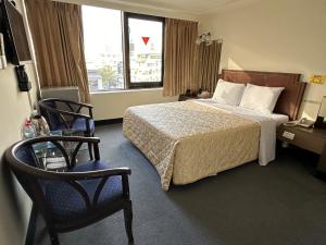 Letto o letti in una camera di Chian Huei Business Hotel