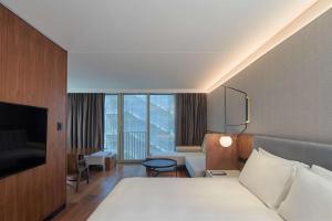 Cama ou camas em um quarto em Park Hyatt Auckland