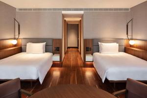 Cama ou camas em um quarto em Park Hyatt Auckland