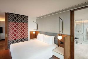 Cama ou camas em um quarto em Park Hyatt Auckland