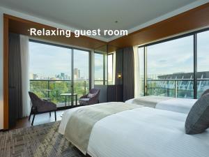 En eller flere senge i et værelse på Mitsui Garden Hotel Jingugaien Tokyo Premier
