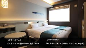 Postel nebo postele na pokoji v ubytování Urban Hotel Kyoto Shijo Premium