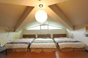 Giường trong phòng chung tại Yun Siang Ju Homestay