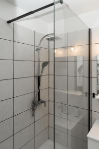 a shower with a glass door in a bathroom at Le Lagon Vert in Saint-François +17 photos