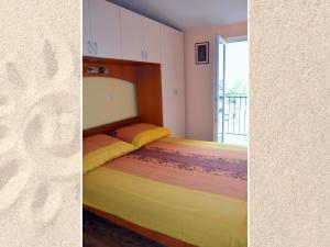 מיטה או מיטות בחדר ב-Apartman Julienne