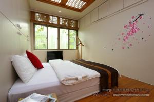 Giường trong phòng chung tại Yun Siang Ju Homestay