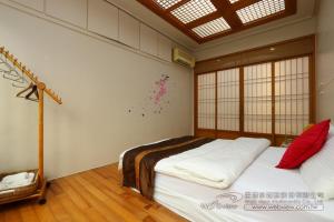 Giường trong phòng chung tại Yun Siang Ju Homestay