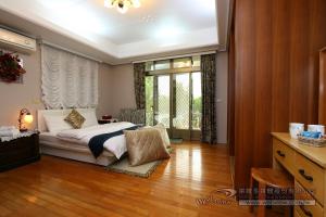 Giường trong phòng chung tại Yun Siang Ju Homestay
