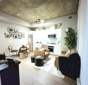 a living room with a couch and a table at Luxurious Downtown condo with spectacular views in Calgary