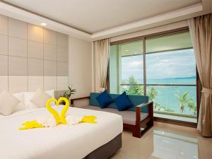 a bedroom with a bed with two swans on it at Oh La La Koh Phangan in Haad Rin +68 photos