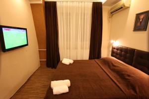 Voodi või voodid majutusasutuse Hotel Petrus toas