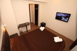 Voodi või voodid majutusasutuse Hotel Petrus toas