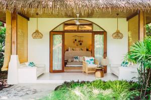 a bedroom in a villa with a bed at Zazen Boutique Resort & Spa in Bophut