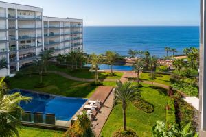 an aerial view of a hotel and the ocean at OurMadeira - Palace Ocean View in Funchal