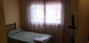 Postel nebo postele na pokoji v ubytování Hotel Balfagón