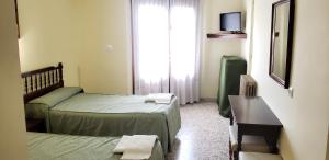 Postel nebo postele na pokoji v ubytování Hotel Balfagón