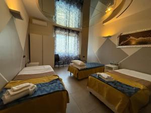 A bed or beds in a room at La Gritta srl