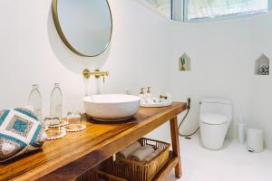a bathroom with a sink and a mirror at Zazen Boutique Resort & Spa in Bophut