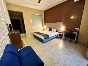 Postel nebo postele na pokoji v ubytování Aryana Queen Beach Resort