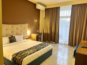Postel nebo postele na pokoji v ubytování Aryana Queen Beach Resort