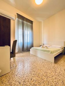 A bed or beds in a room at Mamamia #Politeama