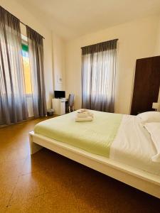 A bed or beds in a room at Mamamia #Politeama