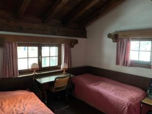 Ein Bett oder Betten in einem Zimmer der Unterkunft Chalet mit Blick auf den Gotschna