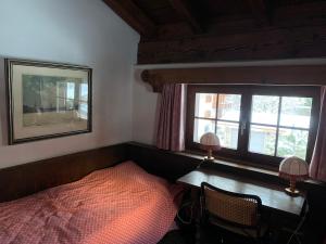 Ein Bett oder Betten in einem Zimmer der Unterkunft Chalet mit Blick auf den Gotschna