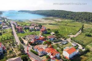 an aerial view of a resort near the water at Charming apartment in Kampor with private garden - 28 m² in Kampor