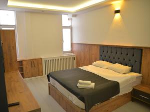 Ένα ή περισσότερα κρεβάτια σε δωμάτιο στο NAHİTA HOTEL