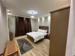 a bedroom with a bed and a large window at Skyline luxury hotel apartments 5 mins from Cairo Airport in Cairo +85 photos