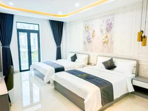 Postel nebo postele na pokoji v ubytování 6668 Hotel - Chi nhánh 2