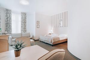 Postel nebo postele na pokoji v ubytování Hotel Amalia