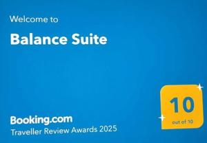 a yellow box with a price sign on it at Balance Suite in Kourouta