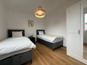 Posteľ alebo postele v izbe v ubytovaní Leopoldsdorf Premium Apartments