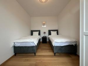 Posteľ alebo postele v izbe v ubytovaní Leopoldsdorf Premium Apartments