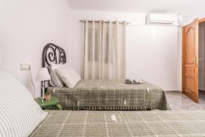 A bed or beds in a room at Apartamento Mágico Javea Arenal