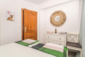 A bed or beds in a room at Apartamento Mágico Javea Arenal
