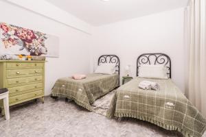 A bed or beds in a room at Apartamento Mágico Javea Arenal