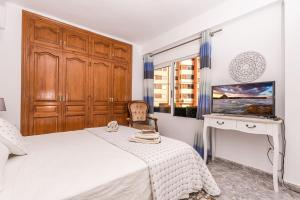 A bed or beds in a room at Apartamento Mágico Javea Arenal