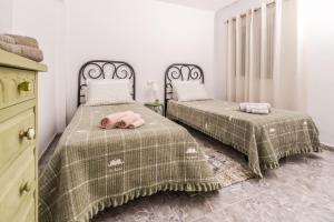 A bed or beds in a room at Apartamento Mágico Javea Arenal