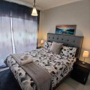 Postel nebo postele na pokoji v ubytování The Blyde 1-Bed Luxe Apartment