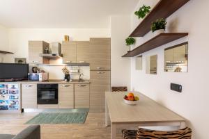 A kitchen or kitchenette at BnButler - Archimede 53 - Bright Studio Még 37 kép