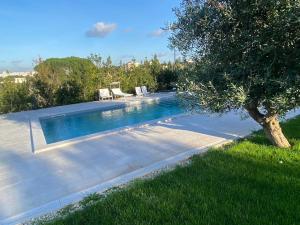 The swimming pool at or close to Trullo Pentimelle e Casa Pentimelle
