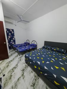 Katil atau katil-katil dalam bilik di Homestay Banting #7, TUTUP SEMENTARA