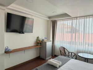 TV a/nebo společenská místnost v ubytování Longzhu Guesthouse