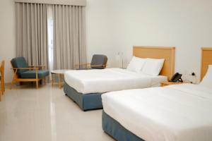 Assia Hotel客房内的一张或多张床位